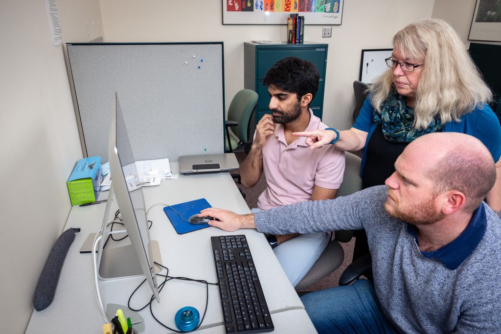 Deanna and her students working on data analyses of functional brain connectivity data collected from individuals with schizophrenia