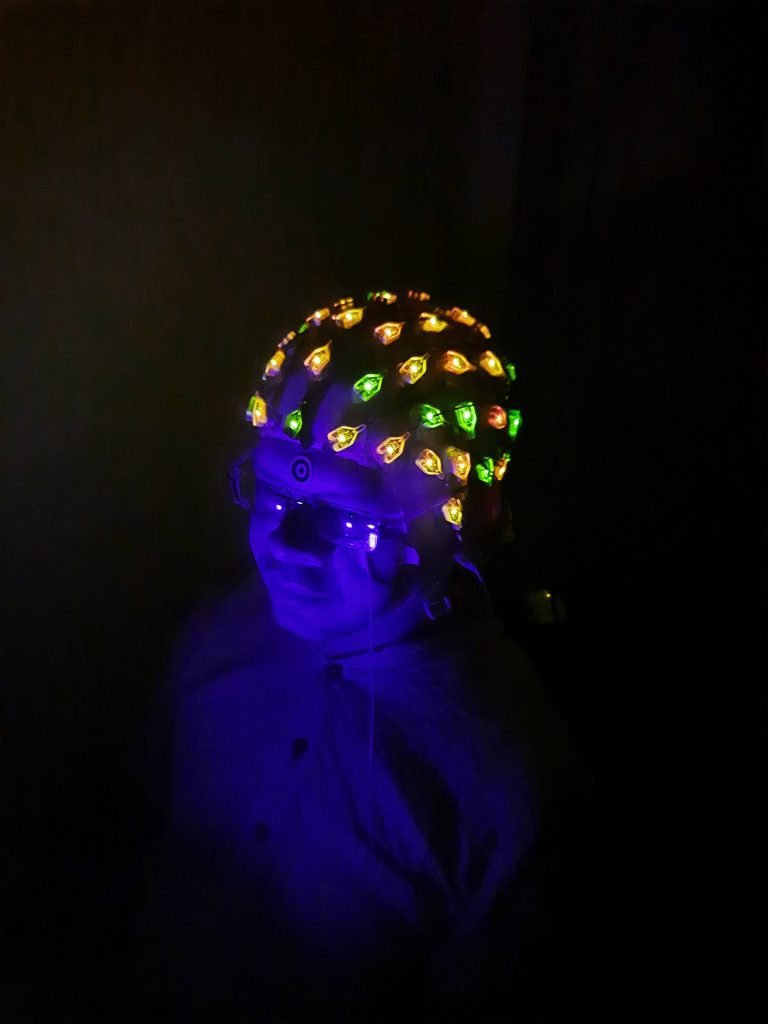 Scientists in Supratim’s lab using an electroencephalogram (EEG) cap to record brain activity and study the effects of meditation on the brain (Photo courtesy: Ankan Biswas) 